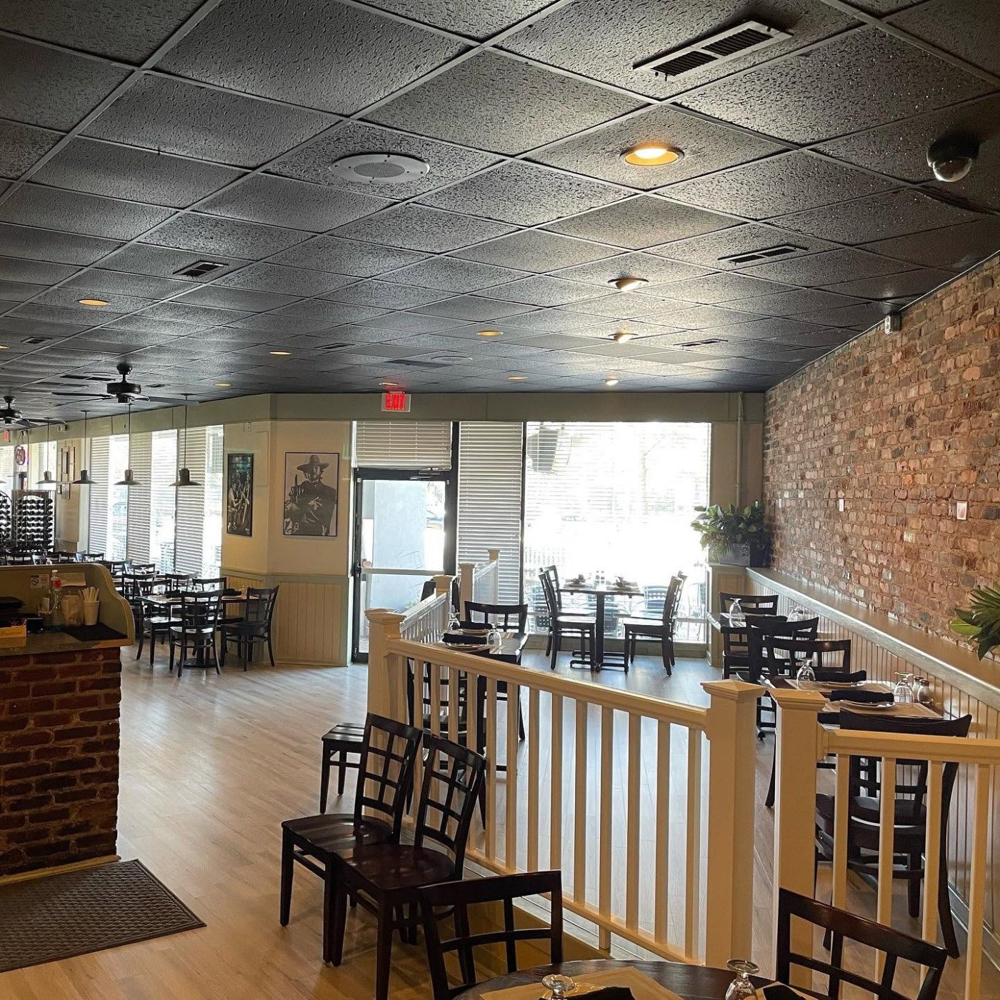Bright dining room with windows at Tuscany Ristorante